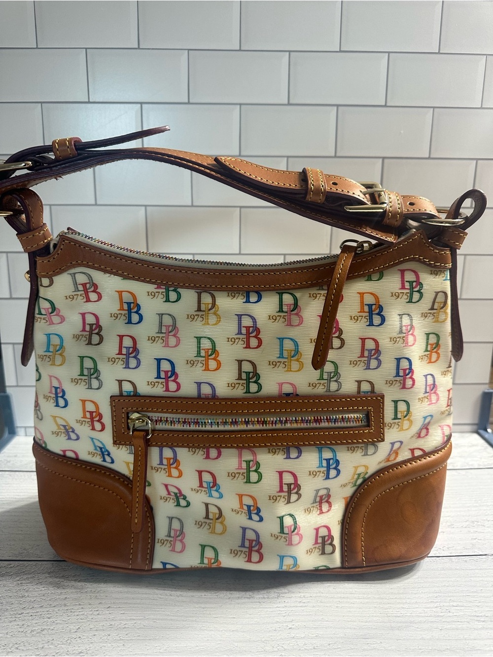 Dooney & Bourke Cream Multicolor DB Logo Shoulder Bag with Brown Trim
